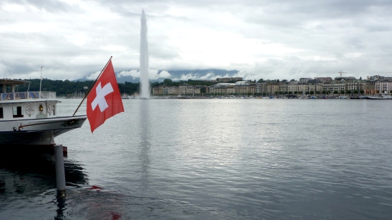 All things Swiss: Lake Geneva's Jet d'Eau sets up the city and the Swiss Alps for a perfect backdrop