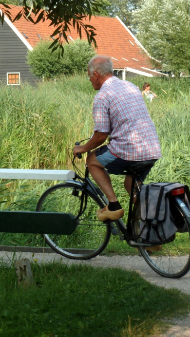 New Feat: Cycling with Clogs on the Feet Zaanse Schans, The Netherlands July 31, 2014