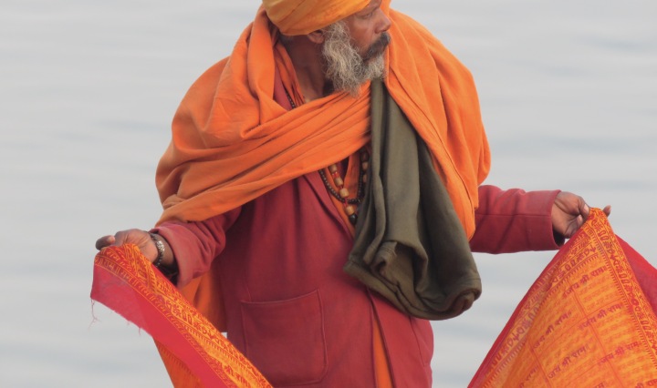 His color is so striking - A man on the Holy Ganges River - Varanasi India - by Anika Mikkelson - Miss Maps