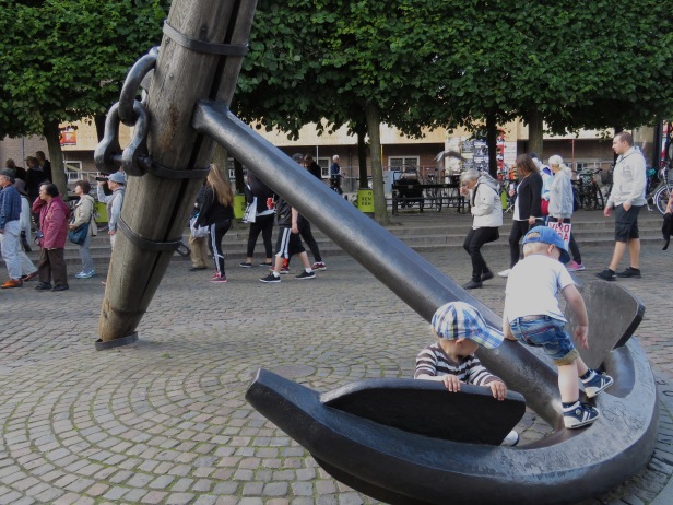 IMG_5469Two young boys play on a large anchor sculpture near Nyhavn Canal in Copenhagen, Denmark - read about the sites and activities in Copenhagen at www.beautifulfillment.com