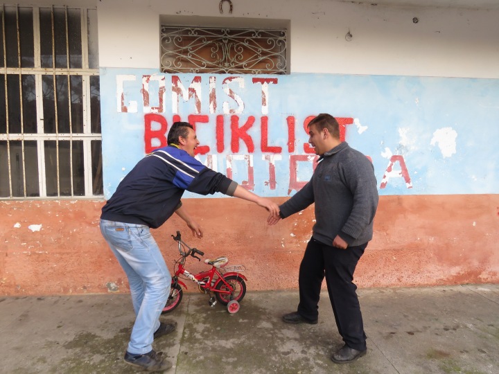 "Take a ride on the tricycle" Their faces say it all - Shkoder Albania - by Anika Mikkelson - Miss Maps - www.MissMaps.com